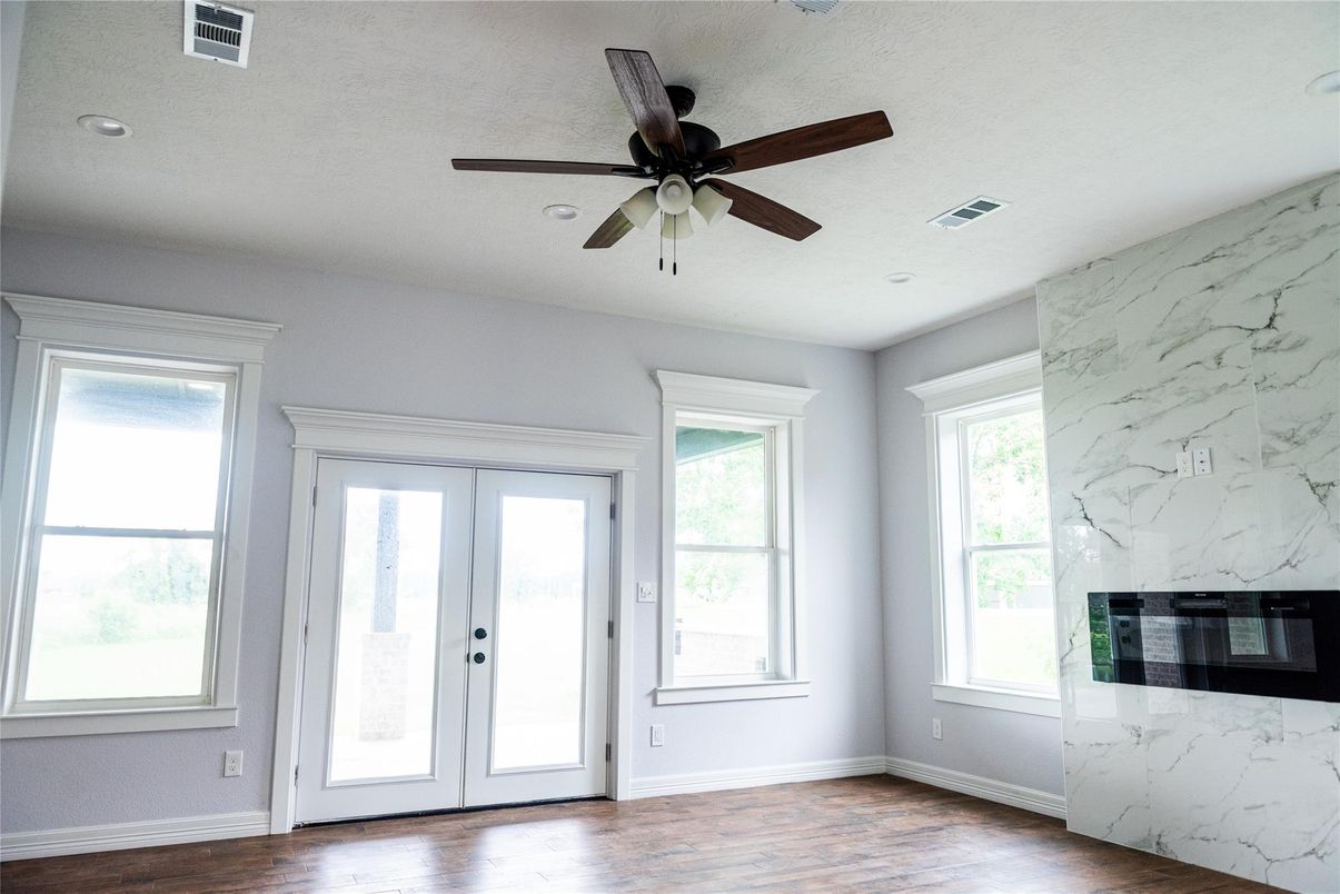 Empty room, Fireplace, Interior, Marble Walls, Recessed Lighting, Wood Texture Flooring