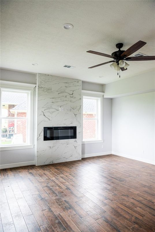 Empty room, Fireplace, Interior, Marble Walls, Recessed Lighting, Wood Texture Flooring