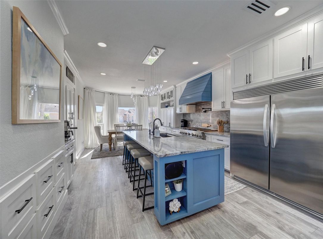 Dining room, Interior, Kitchen, Pendant Lights, Recessed Lighting, Stainless Steel Appliances, Wood Texture Flooring