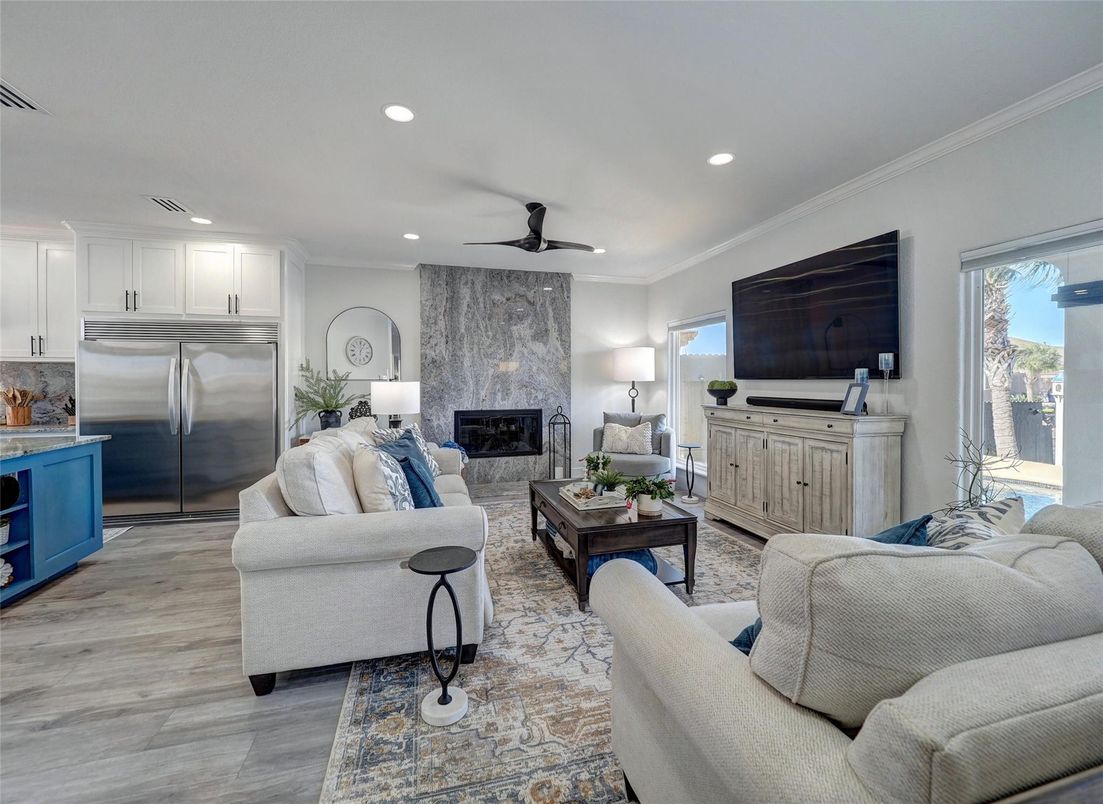 Fireplace, Interior, Kitchen, Living room, Recessed Lighting, Stainless Steel Appliances, Wood Texture Flooring
