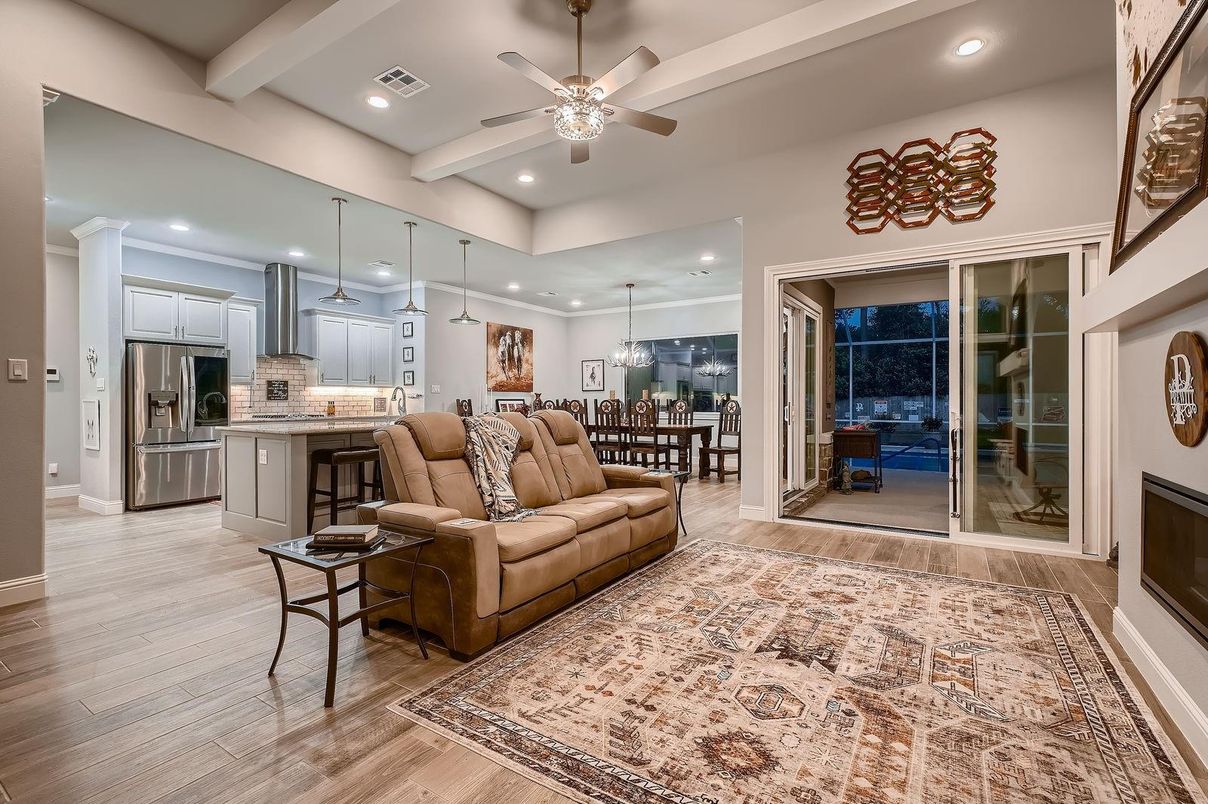 Chandelier, Dining room, Interior, Kitchen, Living room, Pendant Lights, Recessed Lighting, Stainless Steel Appliances, Wood Texture Flooring