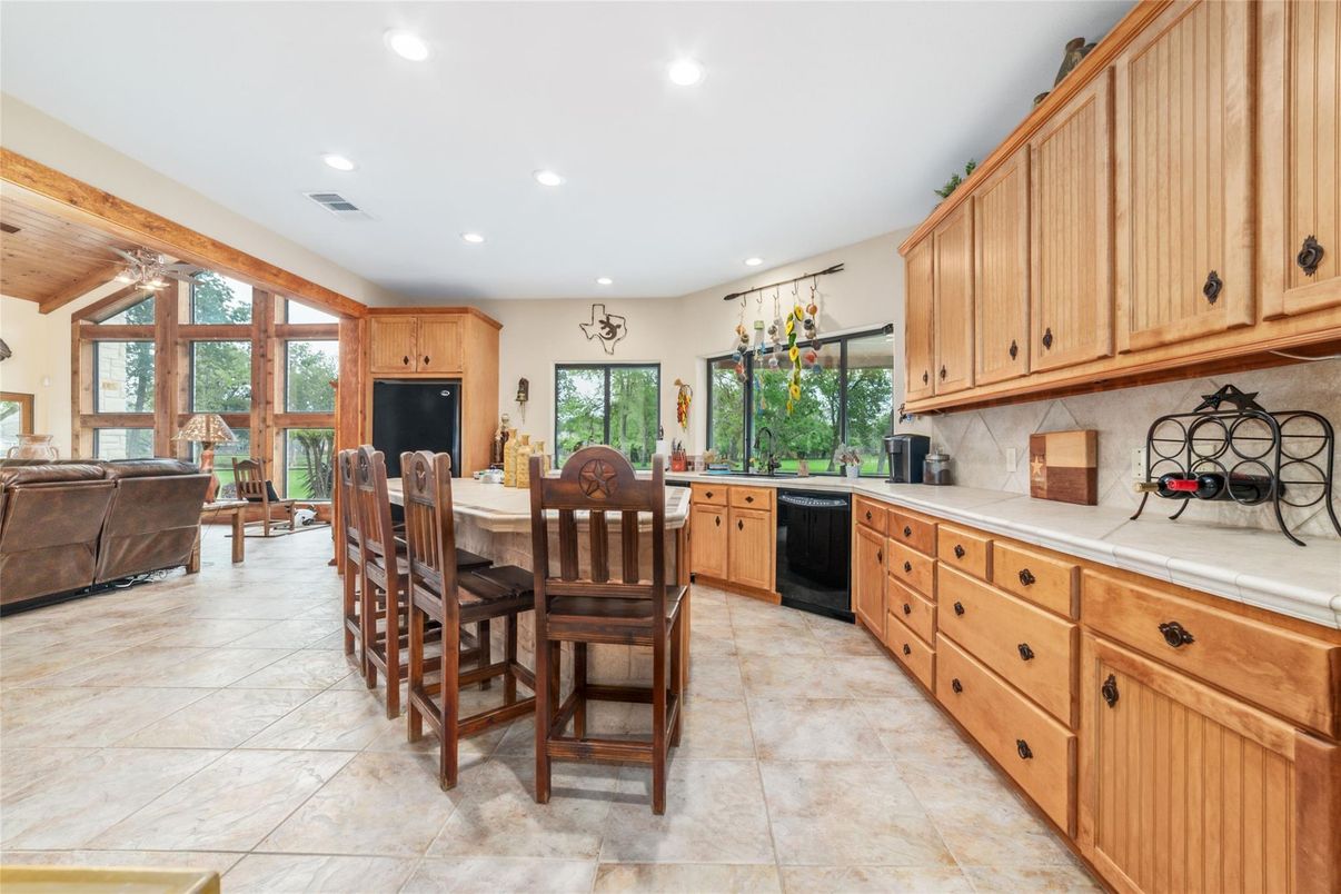 Dining room, Interior, Kitchen, Living room, Recessed Lighting, Tile Countertops, Wooden Ceilings