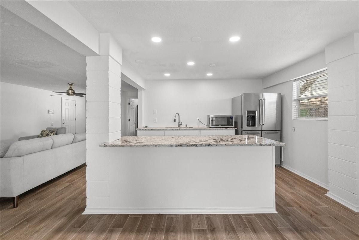 Interior, Kitchen, Recessed Lighting, Stainless Steel Appliances, Wood Texture Flooring