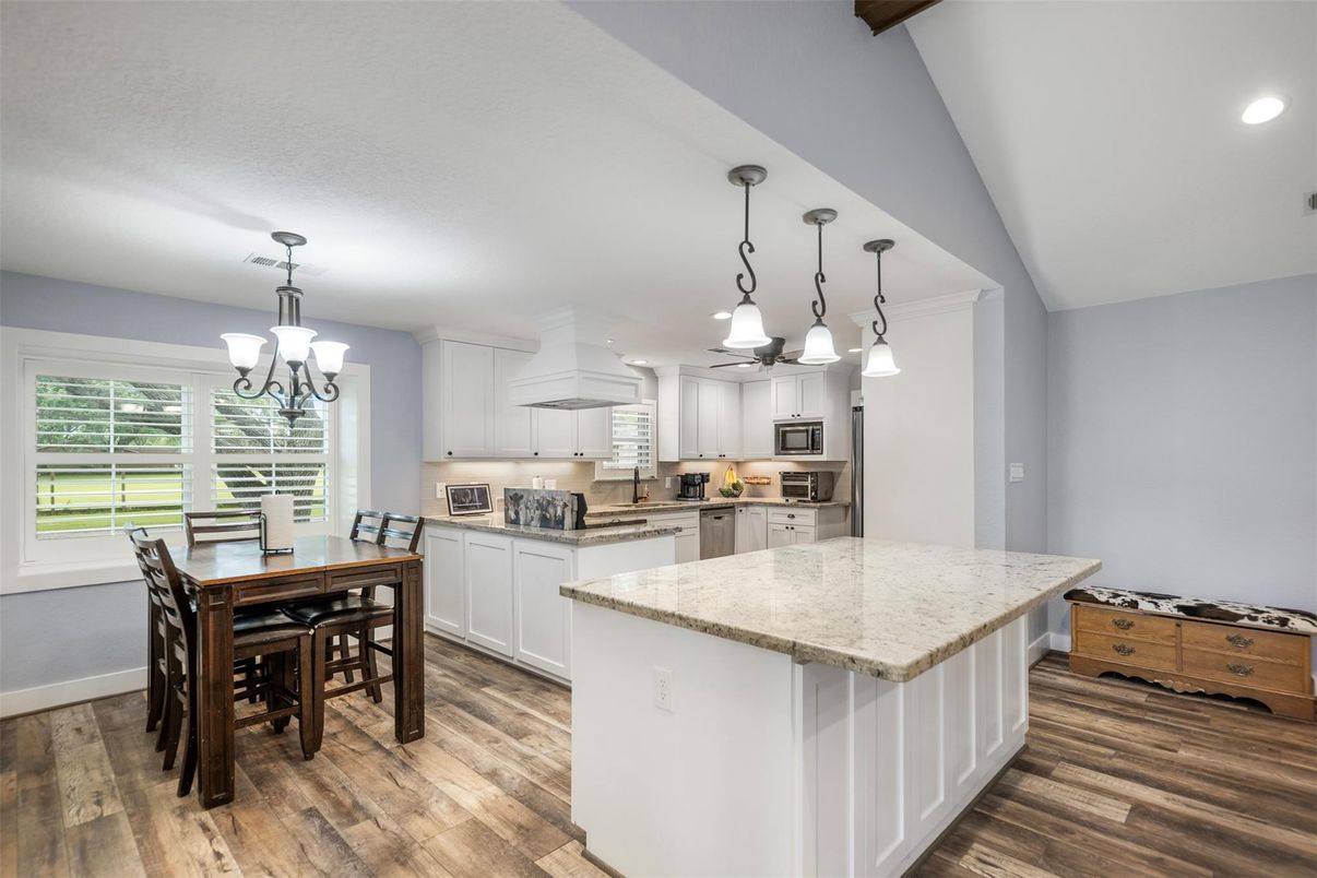 Chandelier, Dining room, Interior, Kitchen, Pendant Lights, Recessed Lighting, Stainless Steel Appliances, Wood Texture Flooring