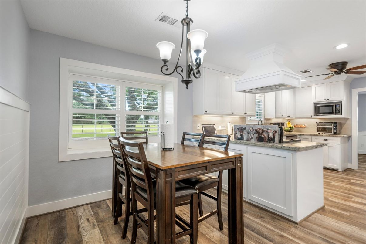 Dining room, Interior, Kitchen, Pendant Lights, Recessed Lighting, Stainless Steel Appliances, Wood Texture Flooring