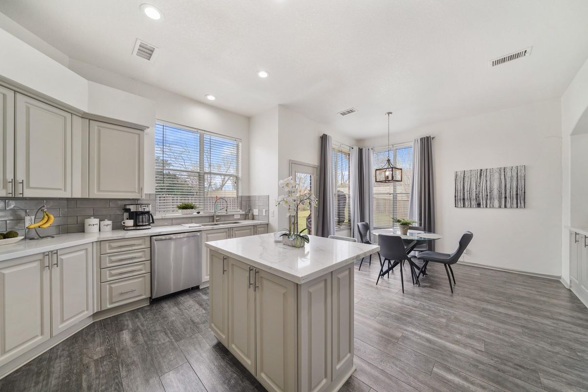 Dining room, Interior, Kitchen, Pendant Lights, Recessed Lighting, Stainless Steel Appliances, Wood Texture Flooring