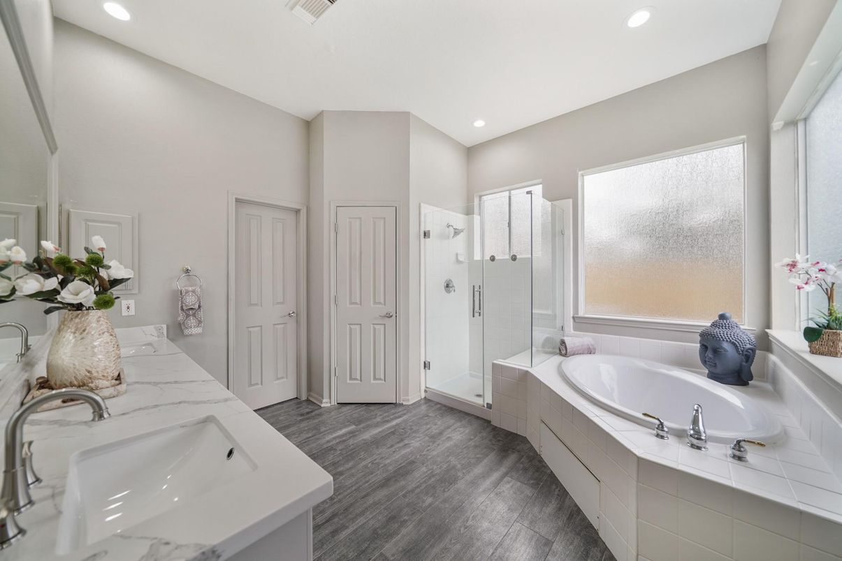 Bathroom, Dual Sink Vanities, Glass Shower, Interior, Recessed Lighting, Wood Texture Flooring