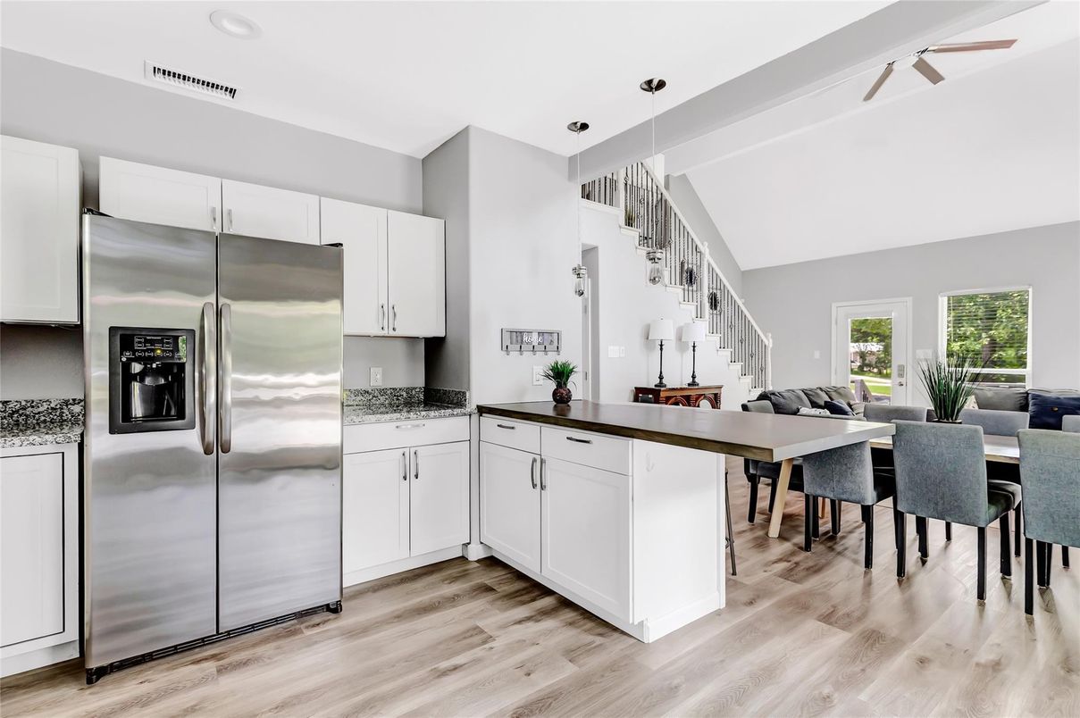 Dining room, Interior, Kitchen, Pendant Lights, Recessed Lighting, Stainless Steel Appliances, Wood Texture Flooring