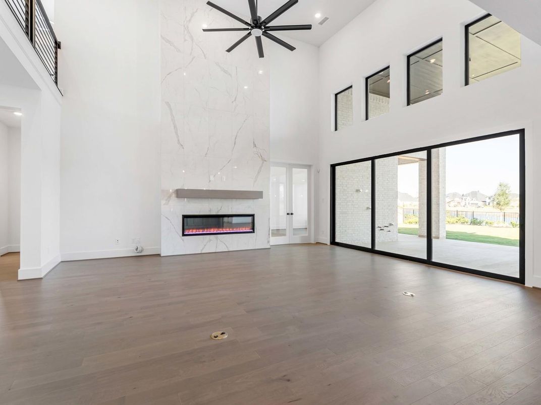 Fireplace, Interior, Marble Walls, Pendant Lights, Recessed Lighting, Wood Texture Flooring