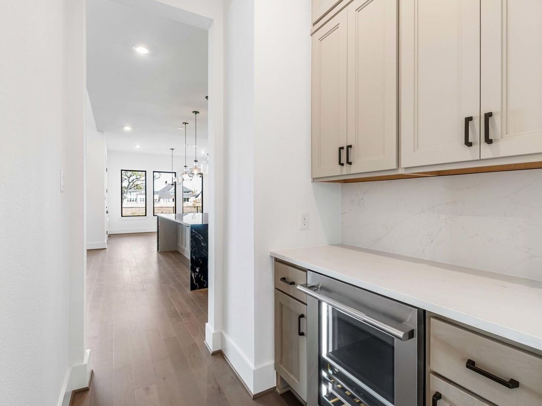 Interior, Kitchen, Marble Walls, Pendant Lights, Recessed Lighting, Stainless Steel Appliances, Wood Texture Flooring