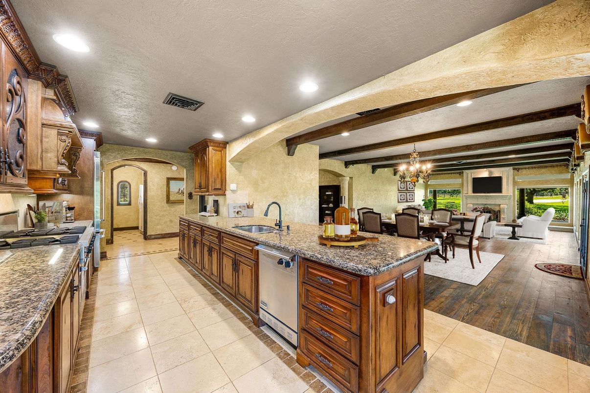 Chandelier, Dining room, Interior, Kitchen, Living room, Recessed Lighting, Stainless Steel Appliances, Wooden Beams, Wood Texture Flooring