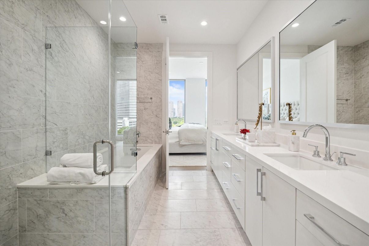 Bathroom, Dual Sink Vanities, Glass Shower, Interior, Marble, Marble Walls, Recessed Lighting