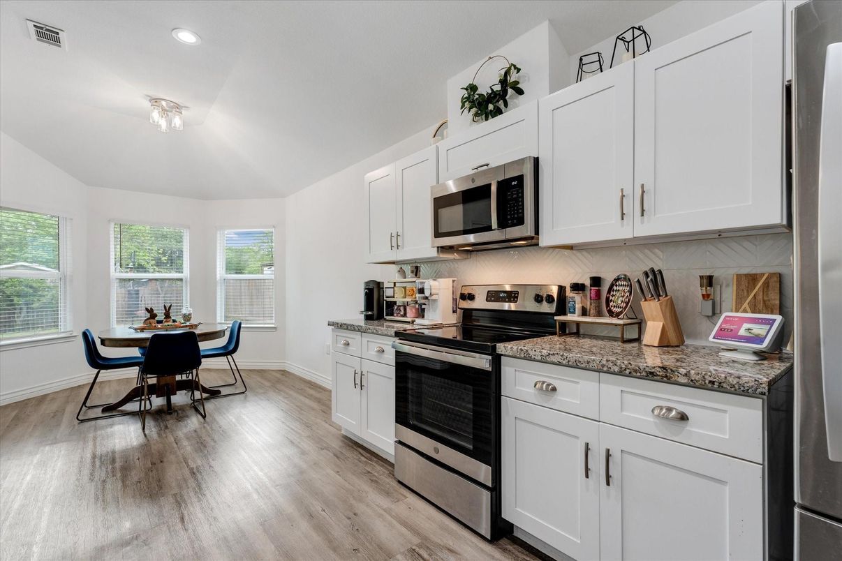 Dining room, Interior, Kitchen, Recessed Lighting, Stainless Steel Appliances, Wood Texture Flooring