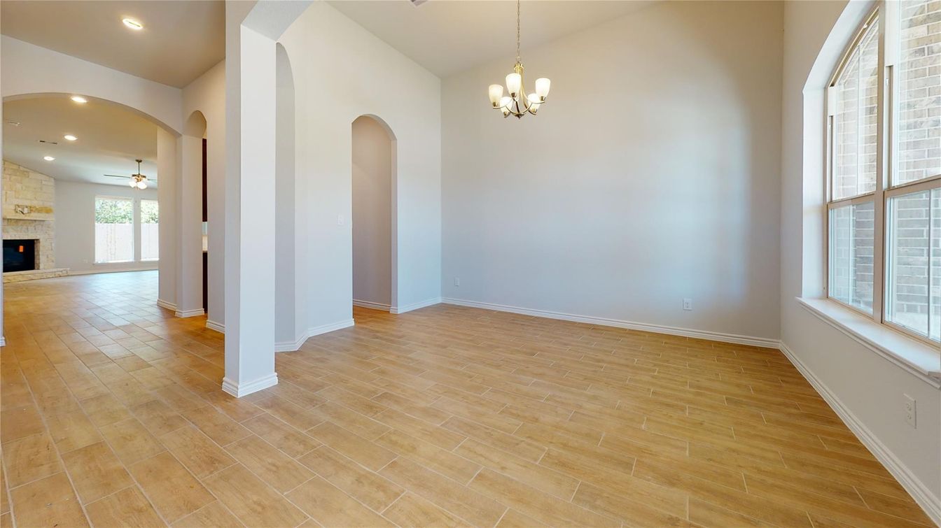Chandelier, Empty room, Fireplace, Interior, Recessed Lighting, Wood Texture Flooring