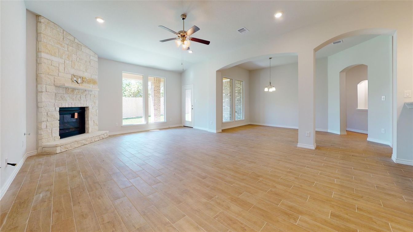 Empty room, Fireplace, Interior, Pendant Lights, Recessed Lighting, Stone Walls, Wood Texture Flooring