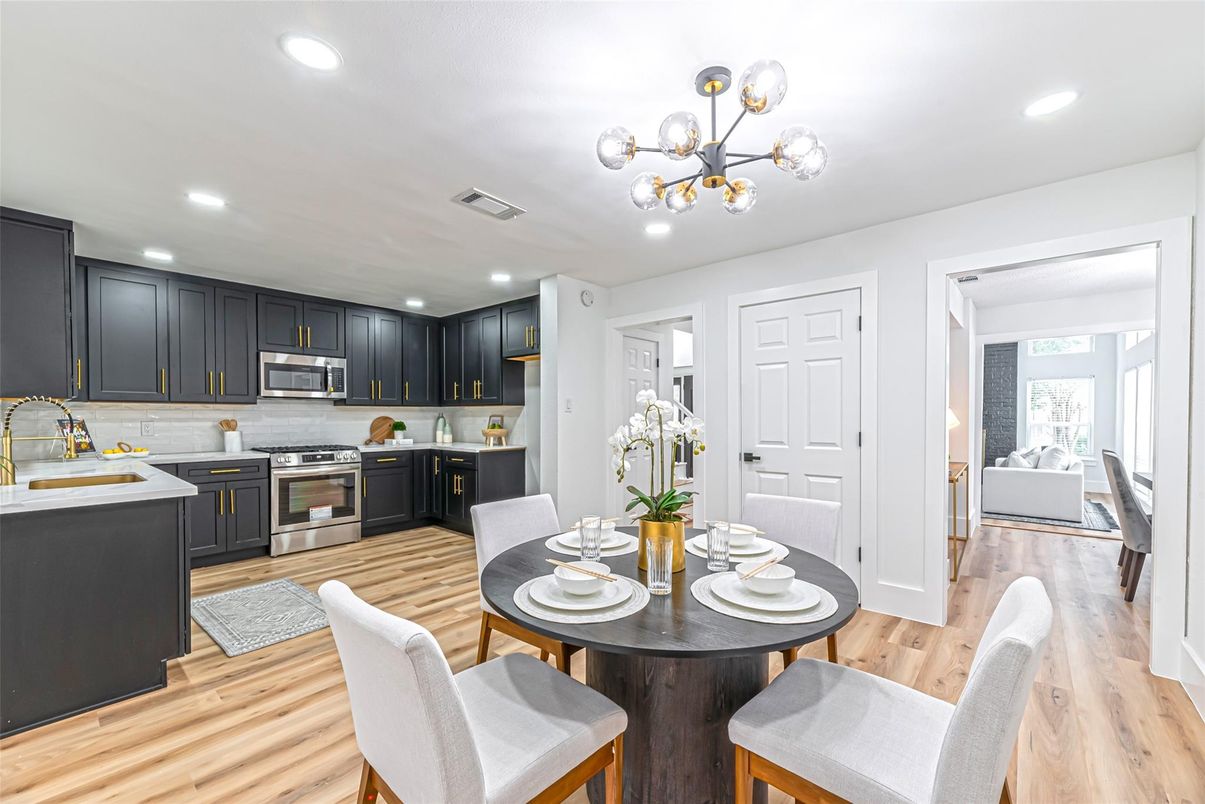 Dining room, Interior, Kitchen, Pendant Lights, Recessed Lighting, Stainless Steel Appliances, Wood Texture Flooring