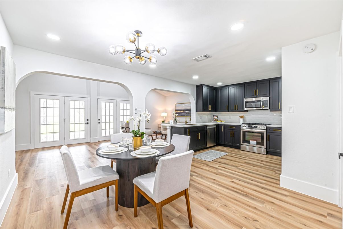 Dining room, Interior, Kitchen, Pendant Lights, Recessed Lighting, Stainless Steel Appliances, Wood Texture Flooring