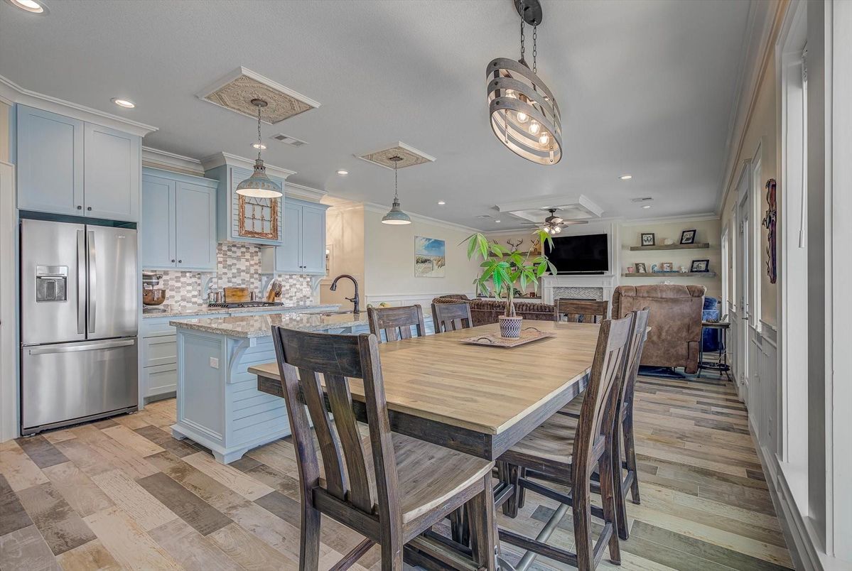 Dining room, Interior, Kitchen, Pendant Lights, Recessed Lighting, Stainless Steel Appliances, Wood Texture Flooring
