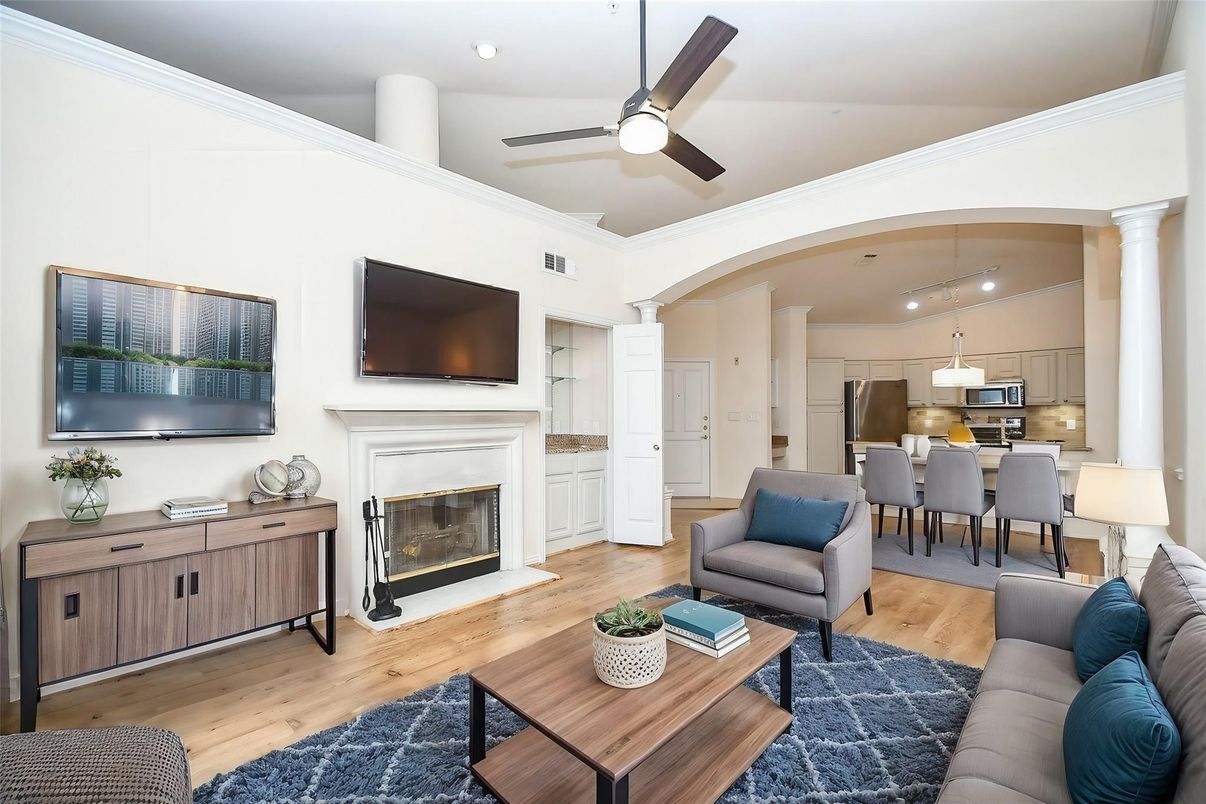 Dining room, Fireplace, Interior, Kitchen, Living room, Pendant Lights, Recessed Lighting, Stainless Steel Appliances, Wood Texture Flooring
