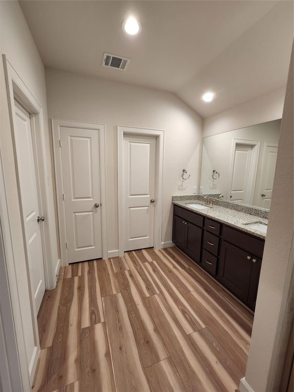 Bathroom, Dual Sink Vanities, Interior, Recessed Lighting, Wood Texture Flooring