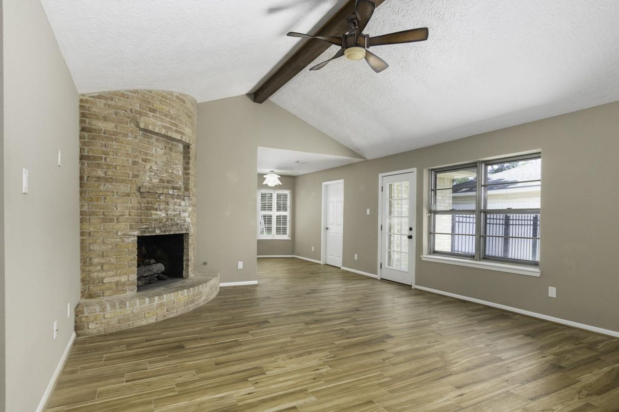 Empty room, Fireplace, Interior, Stone Walls, Wooden Beams, Wood Texture Flooring