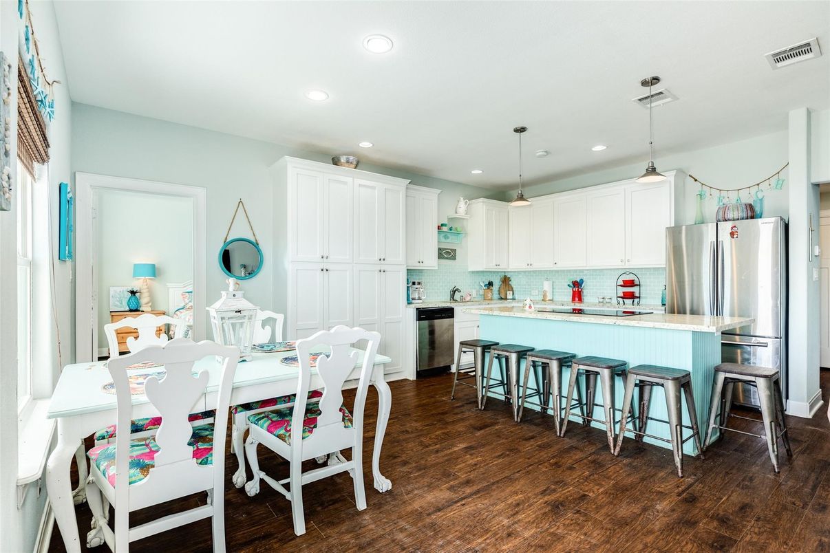 Dining room, Interior, Kitchen, Pendant Lights, Recessed Lighting, Stainless Steel Appliances, Wood Texture Flooring