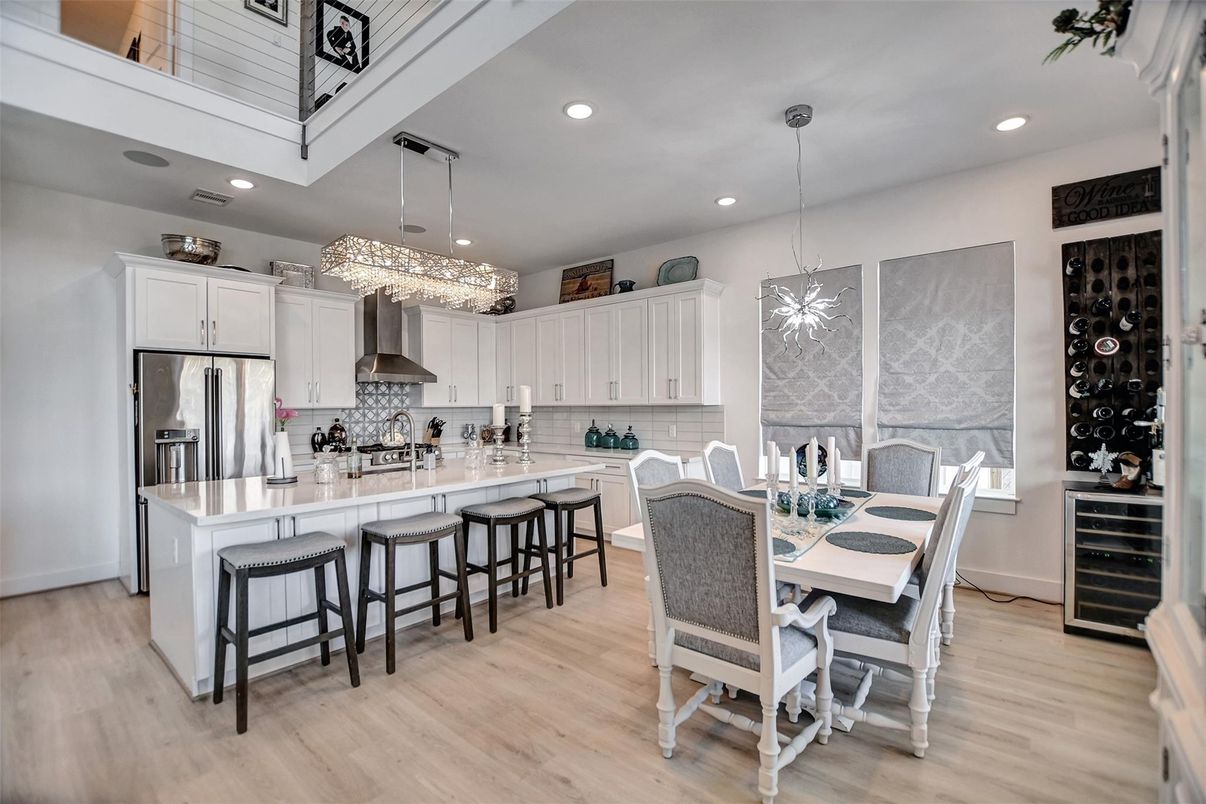 Chandelier, Dining room, Interior, Kitchen, Pendant Lights, Recessed Lighting, Stainless Steel Appliances, Wood Texture Flooring