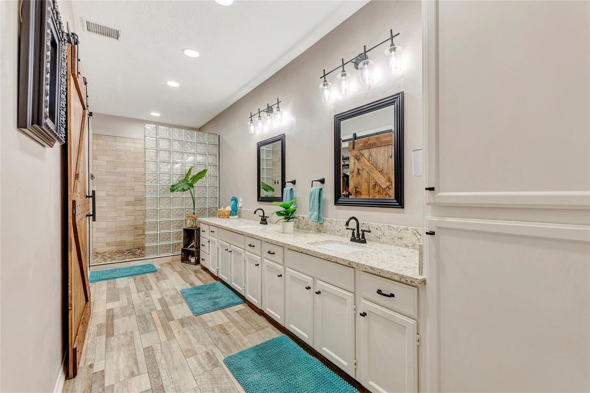Bathroom, Dual Sink Vanities, Glass Shower, Interior, Recessed Lighting, Wood Texture Flooring