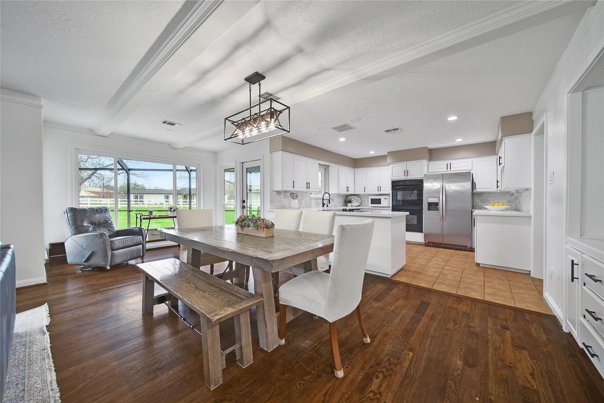 Dining room, Interior, Kitchen, Pendant Lights, Recessed Lighting, Stainless Steel Appliances, Wood Texture Flooring