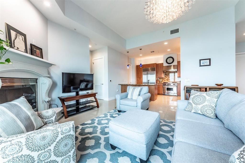 Chandelier, Fireplace, Interior, Kitchen, Living room, Pendant Lights, Recessed Lighting, Stainless Steel Appliances