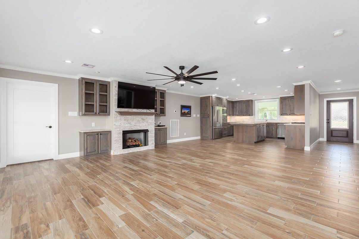 Empty room, Fireplace, Interior, Kitchen, Recessed Lighting, Wood Texture Flooring