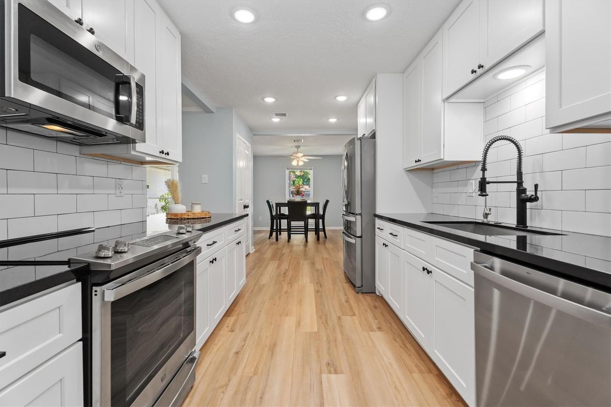 Dining room, Interior, Kitchen, Recessed Lighting, Stainless Steel Appliances, Wood Texture Flooring