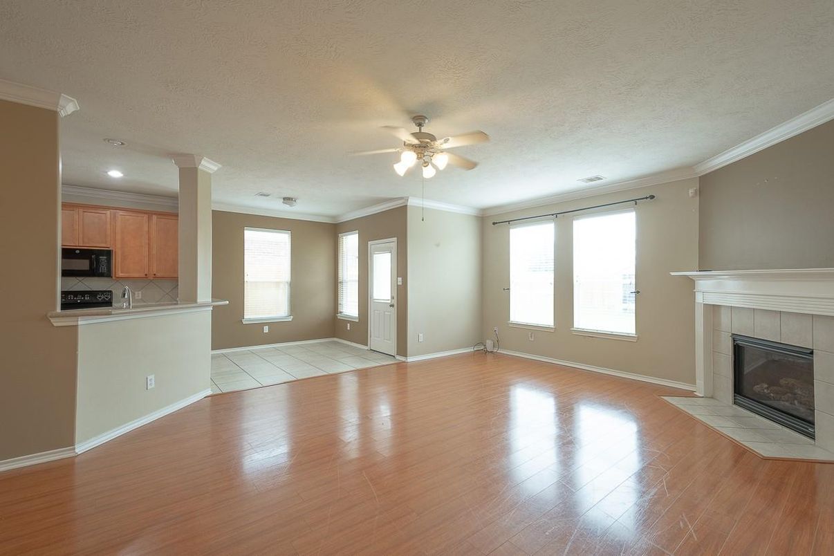 Empty room, Fireplace, Interior, Kitchen, Recessed Lighting, Wood Texture Flooring