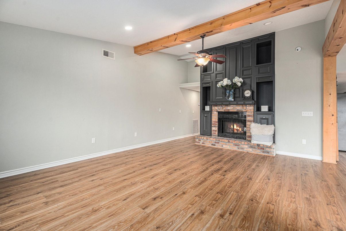 Empty room, Fireplace, Interior, Recessed Lighting, Wooden Beams, Wood Texture Flooring