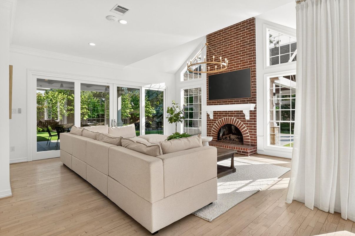 Fireplace, Interior, Living room, Recessed Lighting, Stone Walls, Wood Texture Flooring