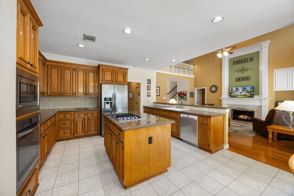 Fireplace, Interior, Kitchen, Living room, Recessed Lighting, Stainless Steel Appliances, Wood Texture Flooring
