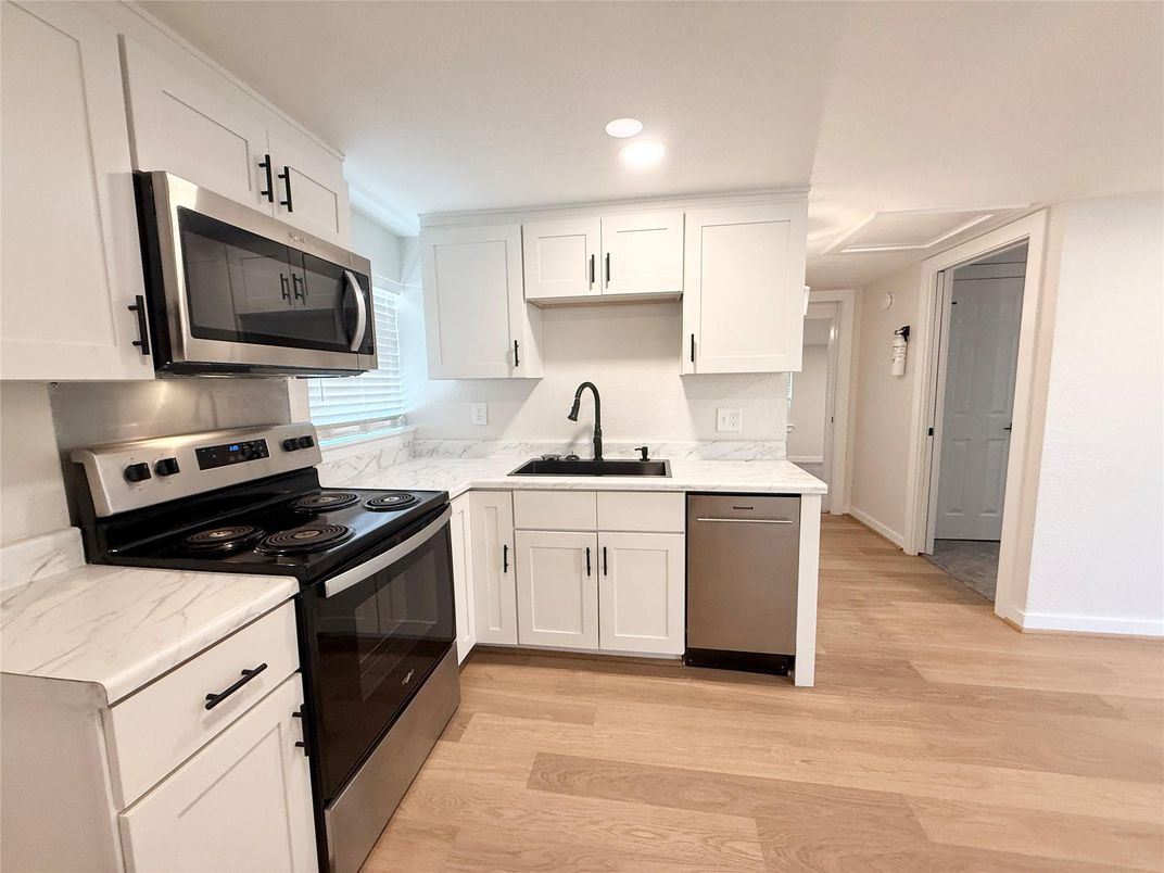 Interior, Kitchen, Recessed Lighting, Stainless Steel Appliances, Wood Texture Flooring
