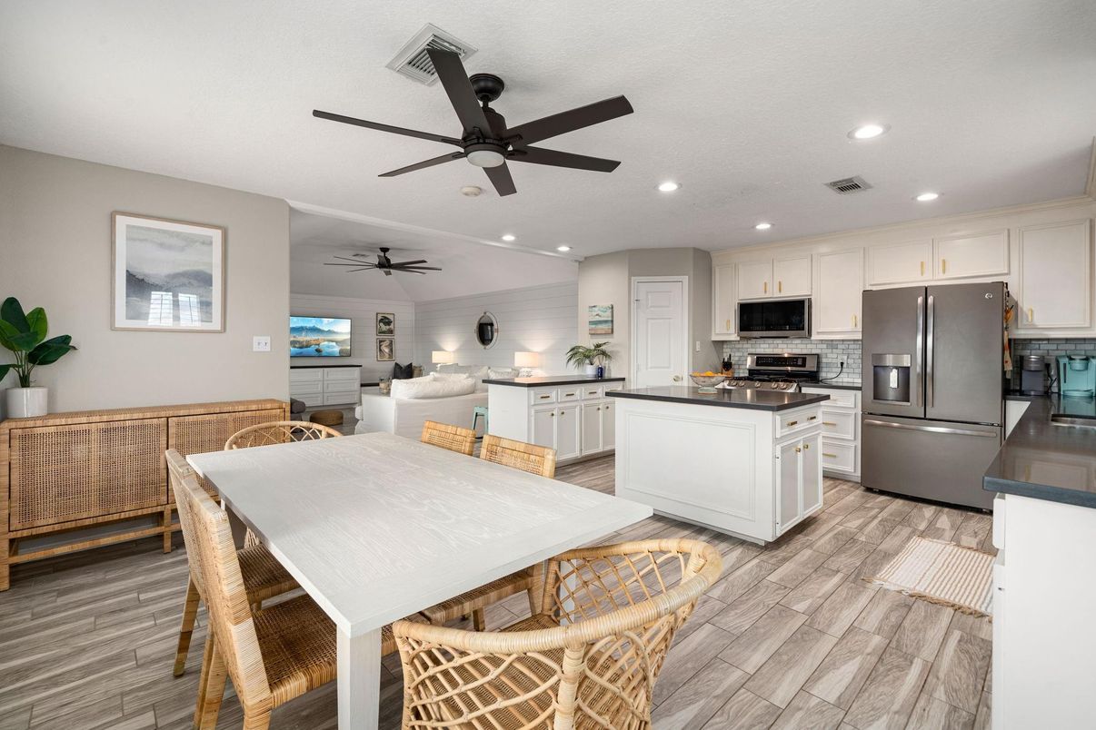 Dining room, Interior, Kitchen, Living room, Recessed Lighting, Stainless Steel Appliances, Wood Texture Flooring
