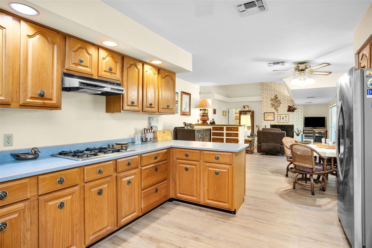 Dining room, Fireplace, Interior, Kitchen, Recessed Lighting, Stone Walls, Wood Texture Flooring