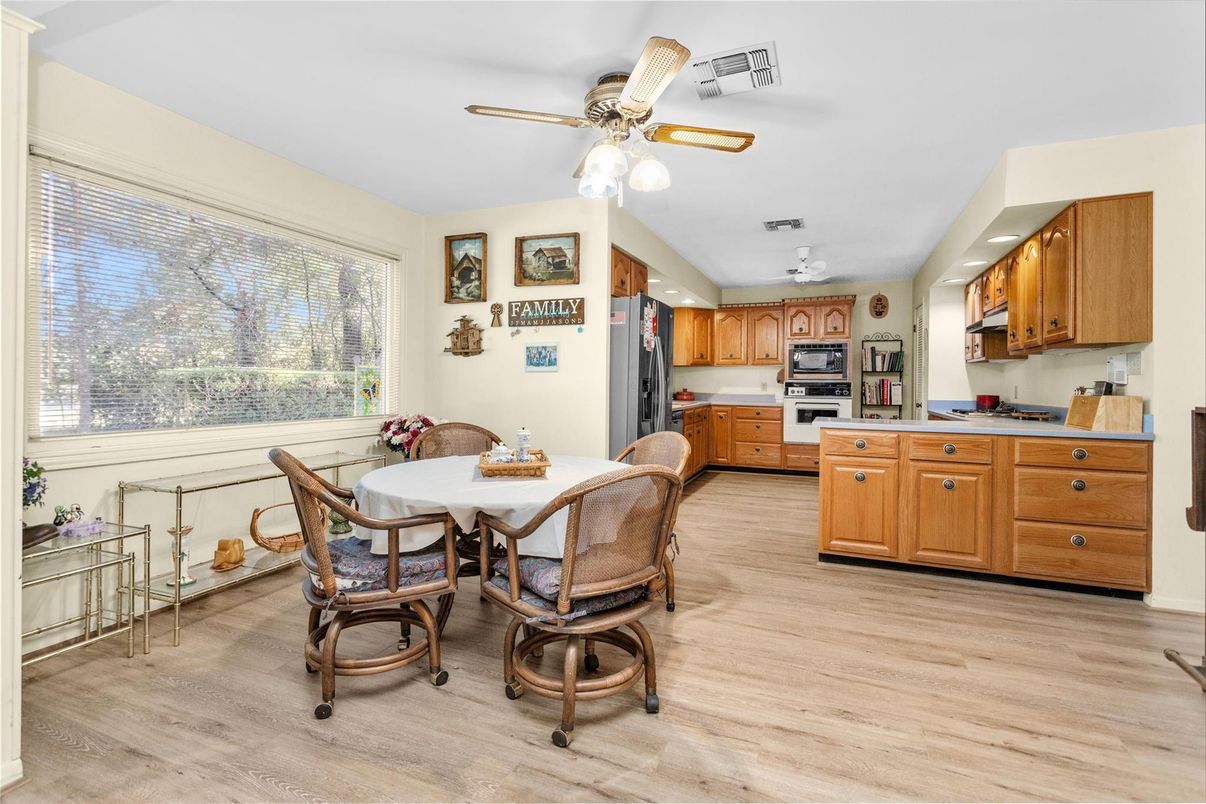 Dining room, Interior, Kitchen, Recessed Lighting, Stainless Steel Appliances, Wood Texture Flooring