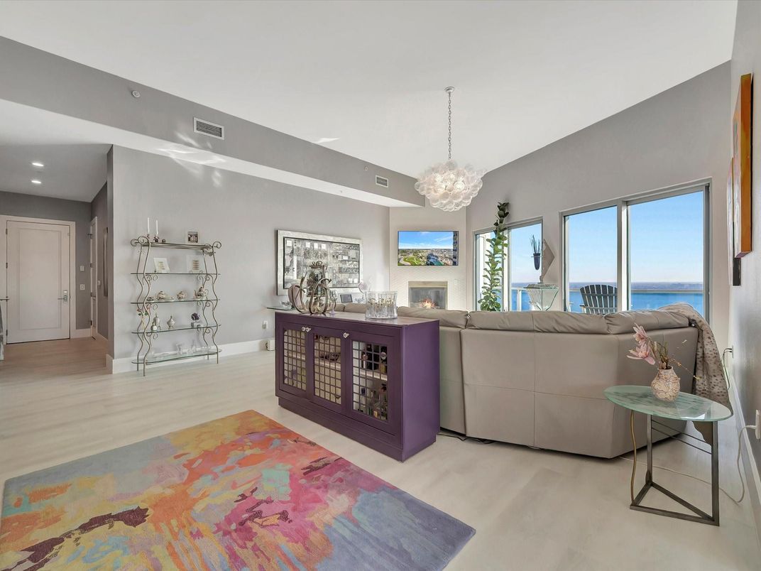 Chandelier, Fireplace, Interior, Living room, Recessed Lighting, Water, Wood Texture Flooring