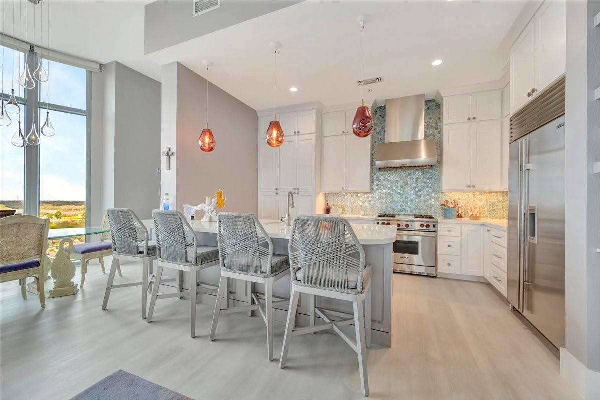 Dining room, Interior, Kitchen, Pendant Lights, Recessed Lighting, Stainless Steel Appliances, Wood Texture Flooring