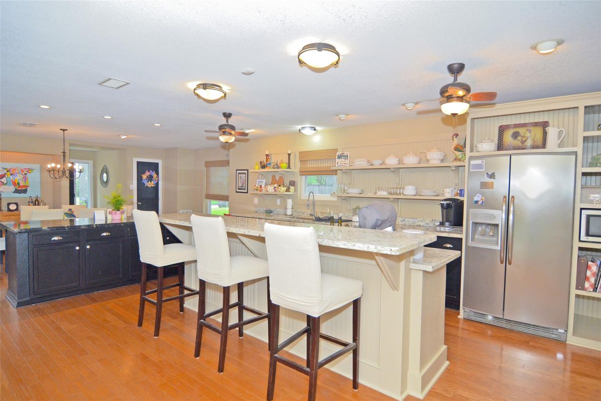Chandelier, Dining room, Interior, Kitchen, Pendant Lights, Recessed Lighting, Stainless Steel Appliances, Wood Texture Flooring