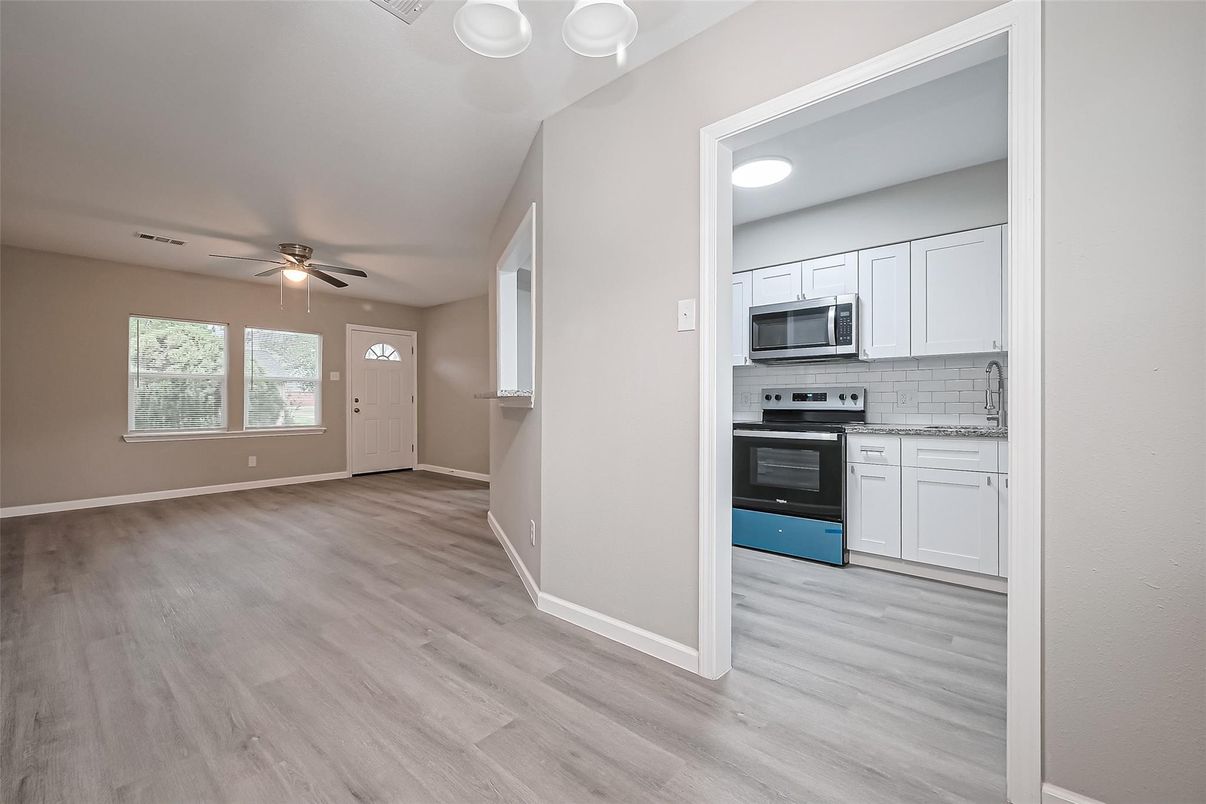 Empty room, Interior, Kitchen, Stainless Steel Appliances, Wood Texture Flooring