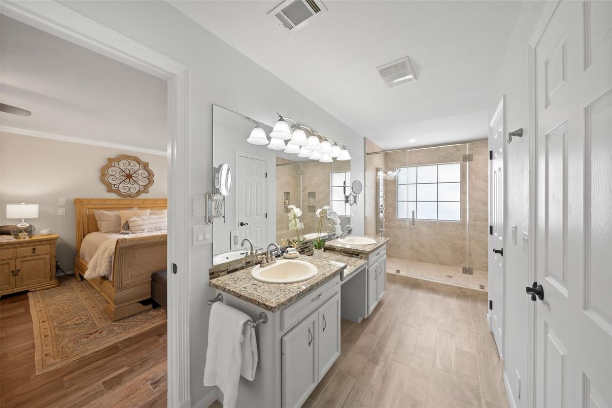Bathroom, Bedroom, Dual Sink Vanities, Glass Shower, Interior, Recessed Lighting, Wood Texture Flooring