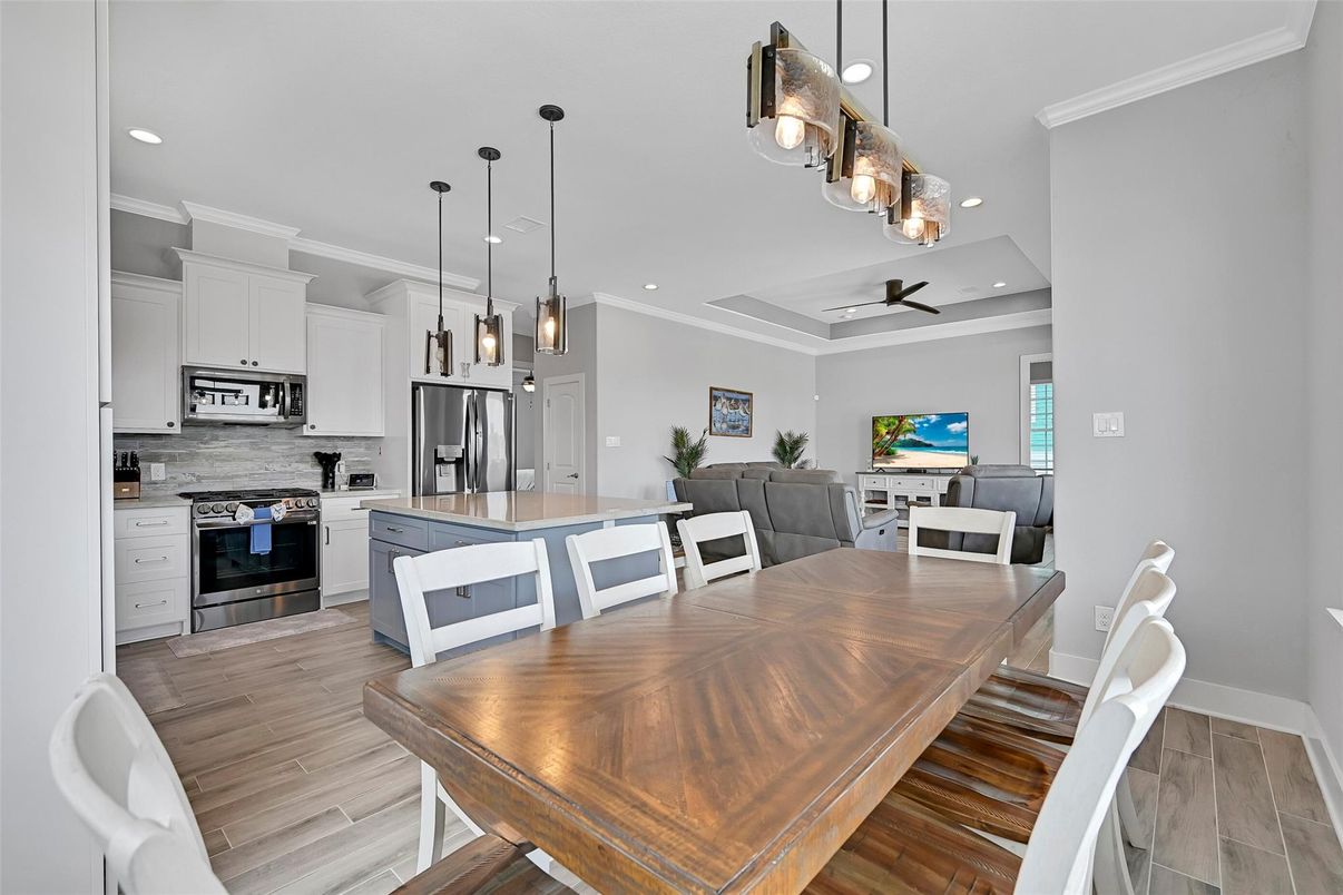Dining room, Interior, Kitchen, Pendant Lights, Recessed Lighting, Stainless Steel Appliances, Wood Texture Flooring