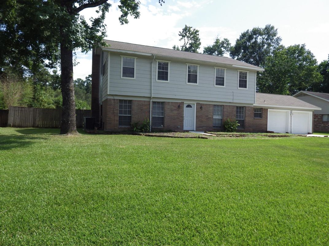 Attached, Backyard, Exterior, Facade, Brick Facade, Raised Ranch