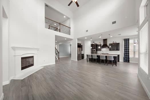 Dining room, Fireplace, Interior, Kitchen, Pendant Lights, Recessed Lighting, Stainless Steel Appliances, Wood Texture Flooring