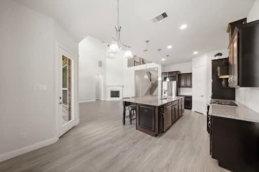 Chandelier, Interior, Kitchen, Pendant Lights, Recessed Lighting, Stainless Steel Appliances, Wood Texture Flooring