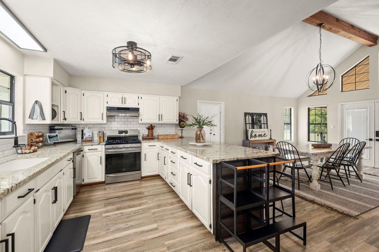 Chandelier, Dining room, Interior, Kitchen, Pendant Lights, Stainless Steel Appliances, Wooden Beams, Wood Texture Flooring